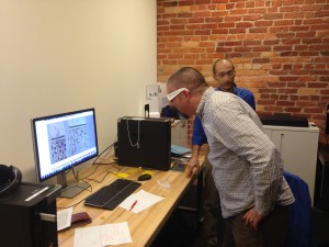 Mike views a mathematically modeled 3D rendering of a tile mosaic.