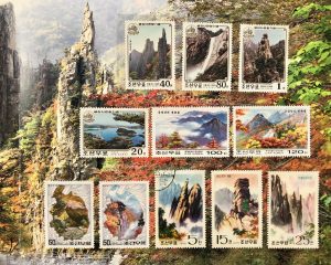 A page from one of the stamp albums showing an assortment of stamps focused on North Korean natural landmarks.
