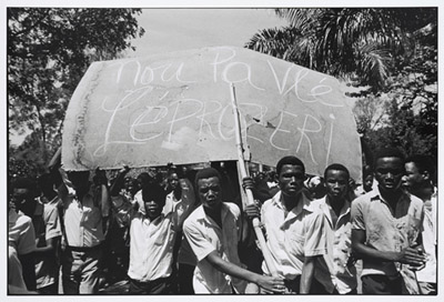 Protesters with large sign, Les Gonaïves, Haiti, 1986 