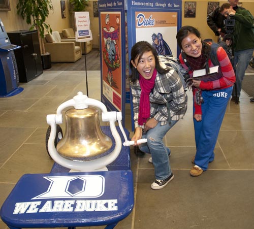 Two more students get ready to ring the Victory Bell.