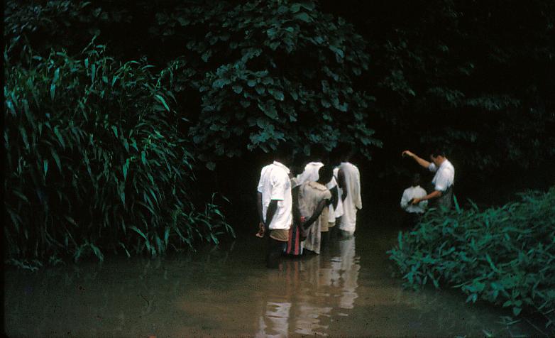 John S. McGee baptizing believers in Nigeria