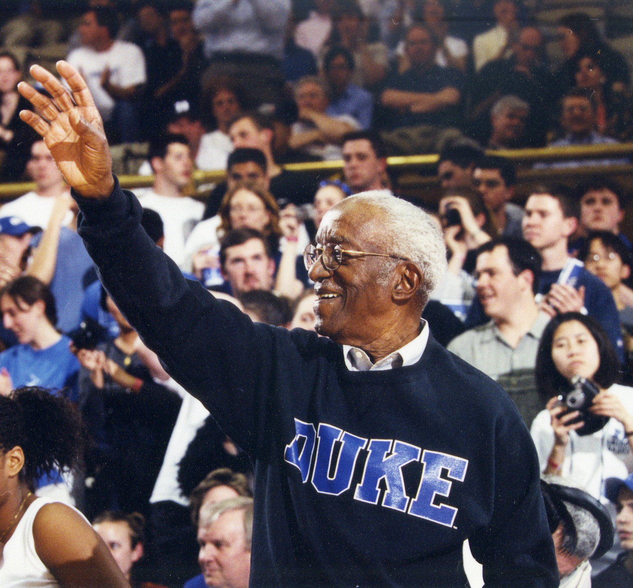 John Hope Franklin attends Duke University basketball game at Cameron Indoor Stadium, 2000