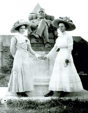 Two Women in front of the Washington Duke statue, ca. 1900s. From the University Archives Photograph Collection.