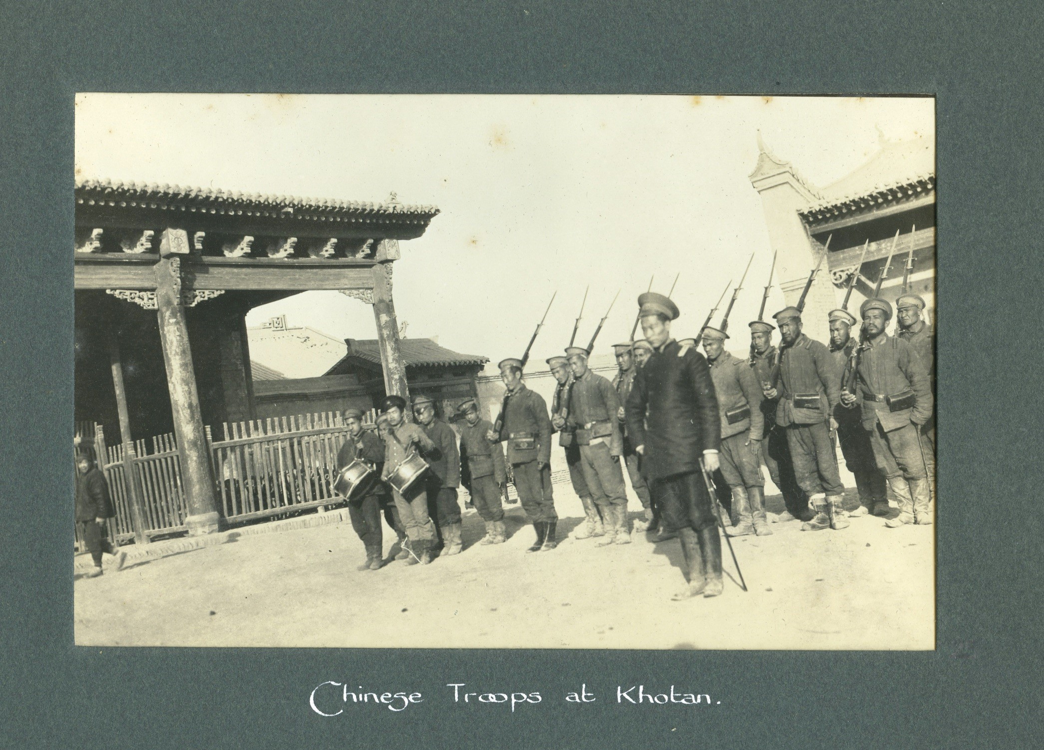 Chinese troops lined up with bayonets and drummer boys.