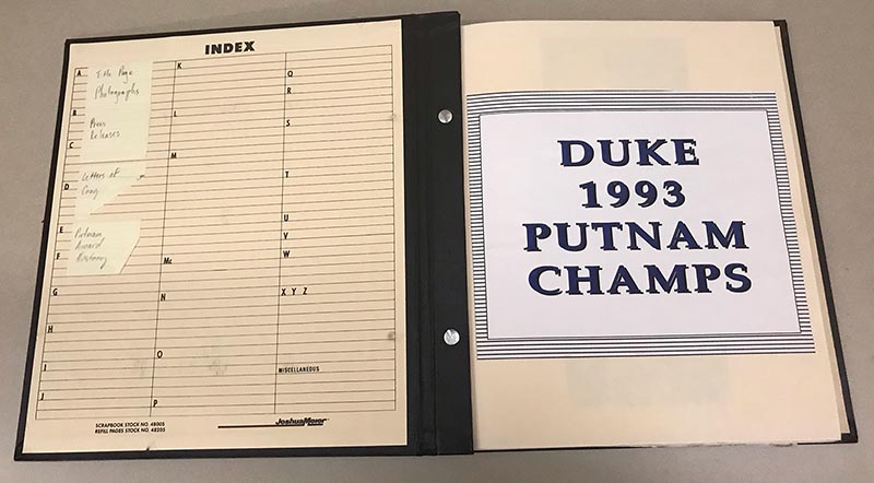 The inside front cover of the Putnam scrapbook. The right-hand page reads "Duke 1993 Putnam Champs in blue capital letters.