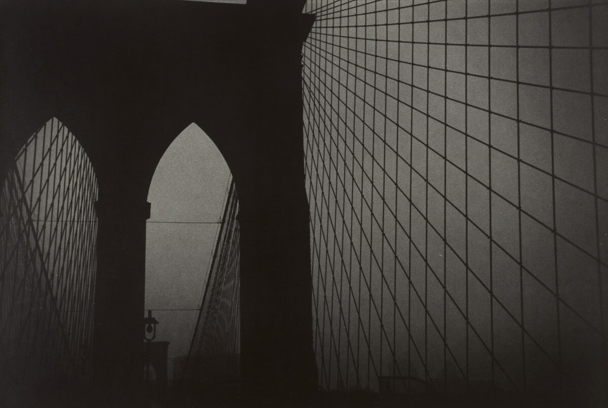 Black and white photograph of the Brooklyn bridge.