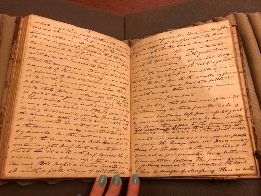 Two open pages of Davisson's notebook. Each page is filled with Davisson's handwritten cursive notes 