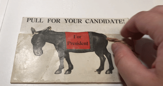 GIF of the postcard showing William Jennings Bryan's head pop out from behind a donkey when the tail is pulled. 