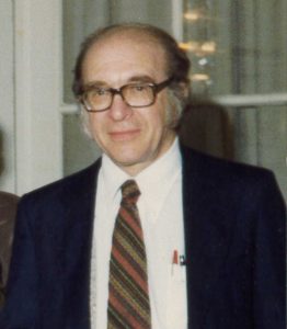 Portrait of Leonid Hurwicz, a middle-aged economist, facing camera.