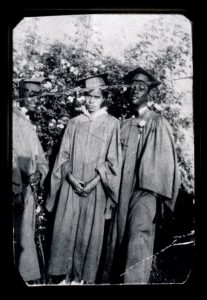 Photo image of boy and girl with a graduation cap and gown