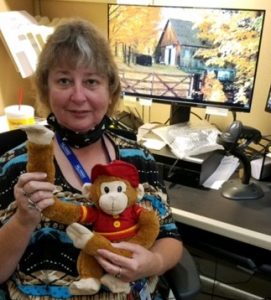 Betsy Sorrell with her Firefigher Monkey in her Smith Warehouse cube
