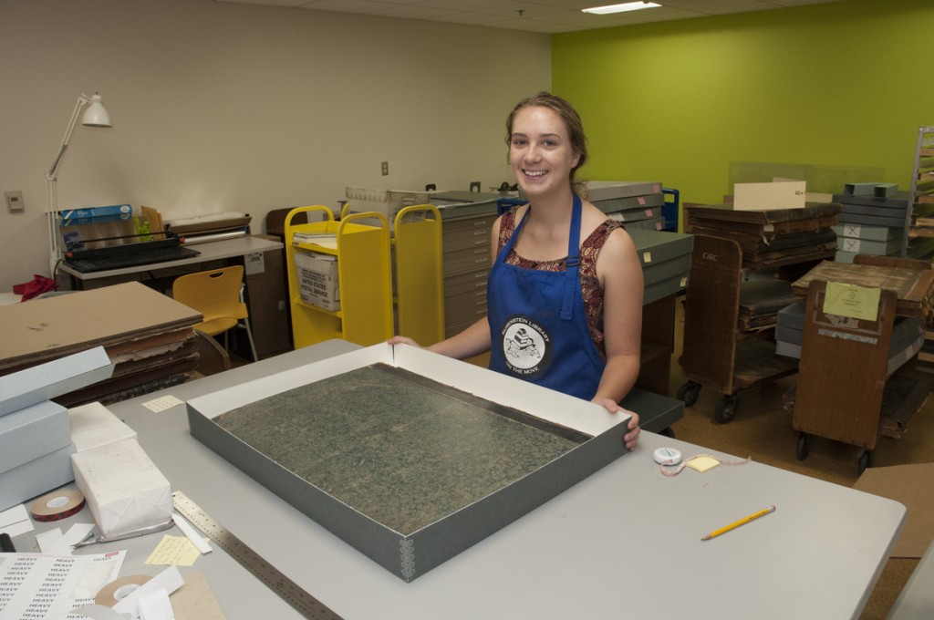 Verne and Tanya Roberts Conservation Lab: Senior psychology major and work-study student Kaiti Dunlap builds custom enclosures for the Rubenstein Library’s fragile historical newspaper collection.