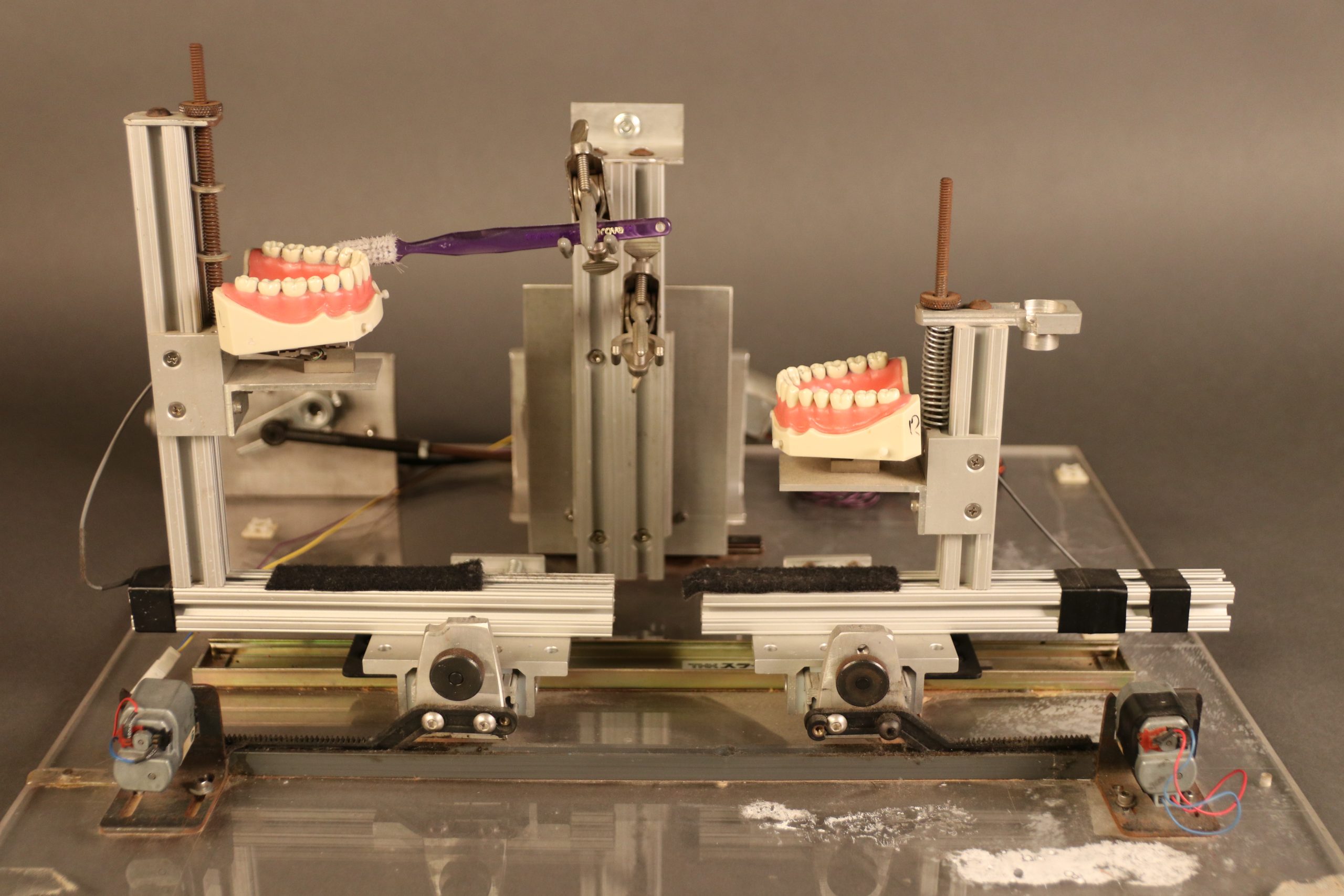 Toothbrush testing device with false teeth