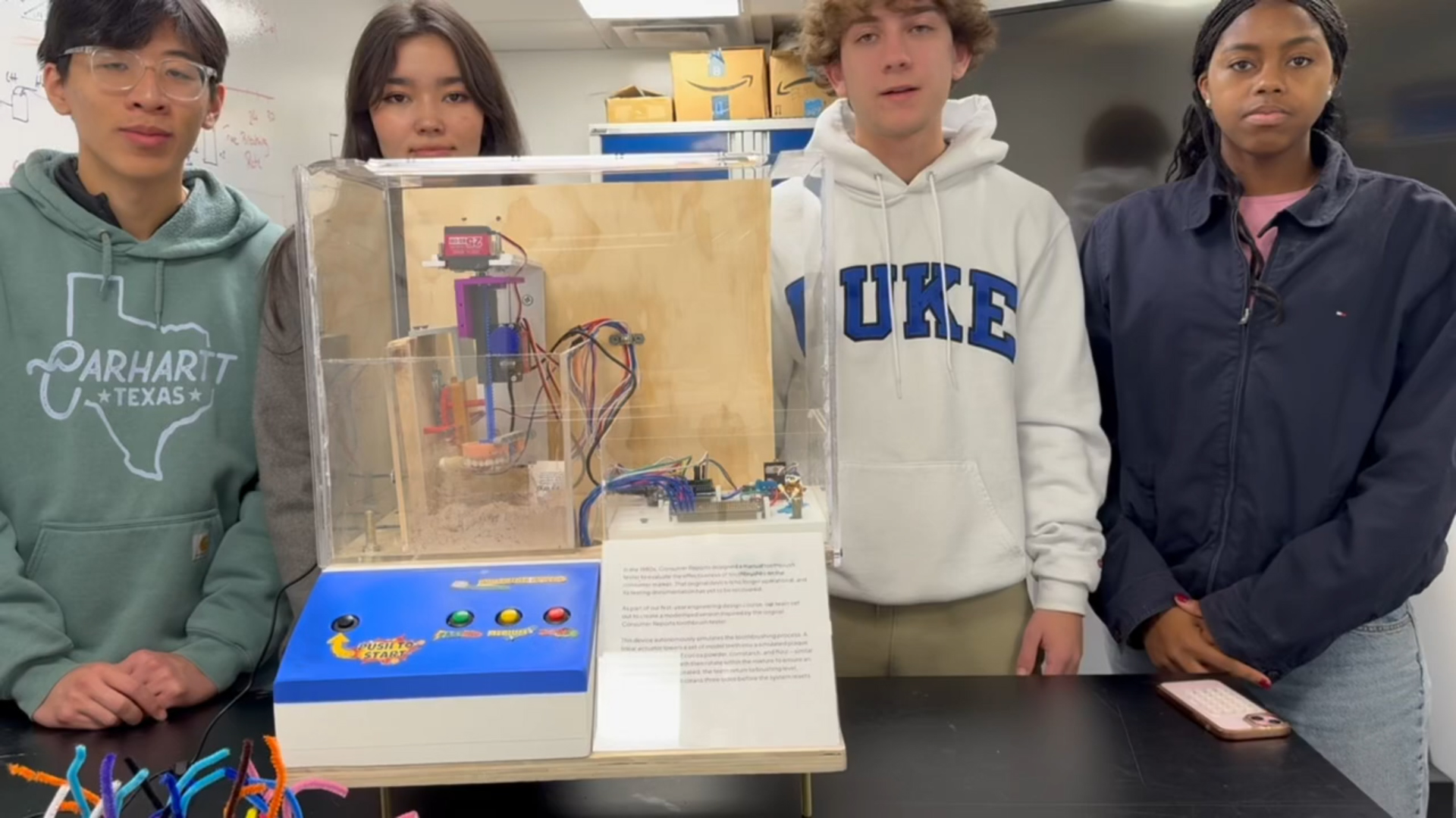 Duke students with toothbrush tester