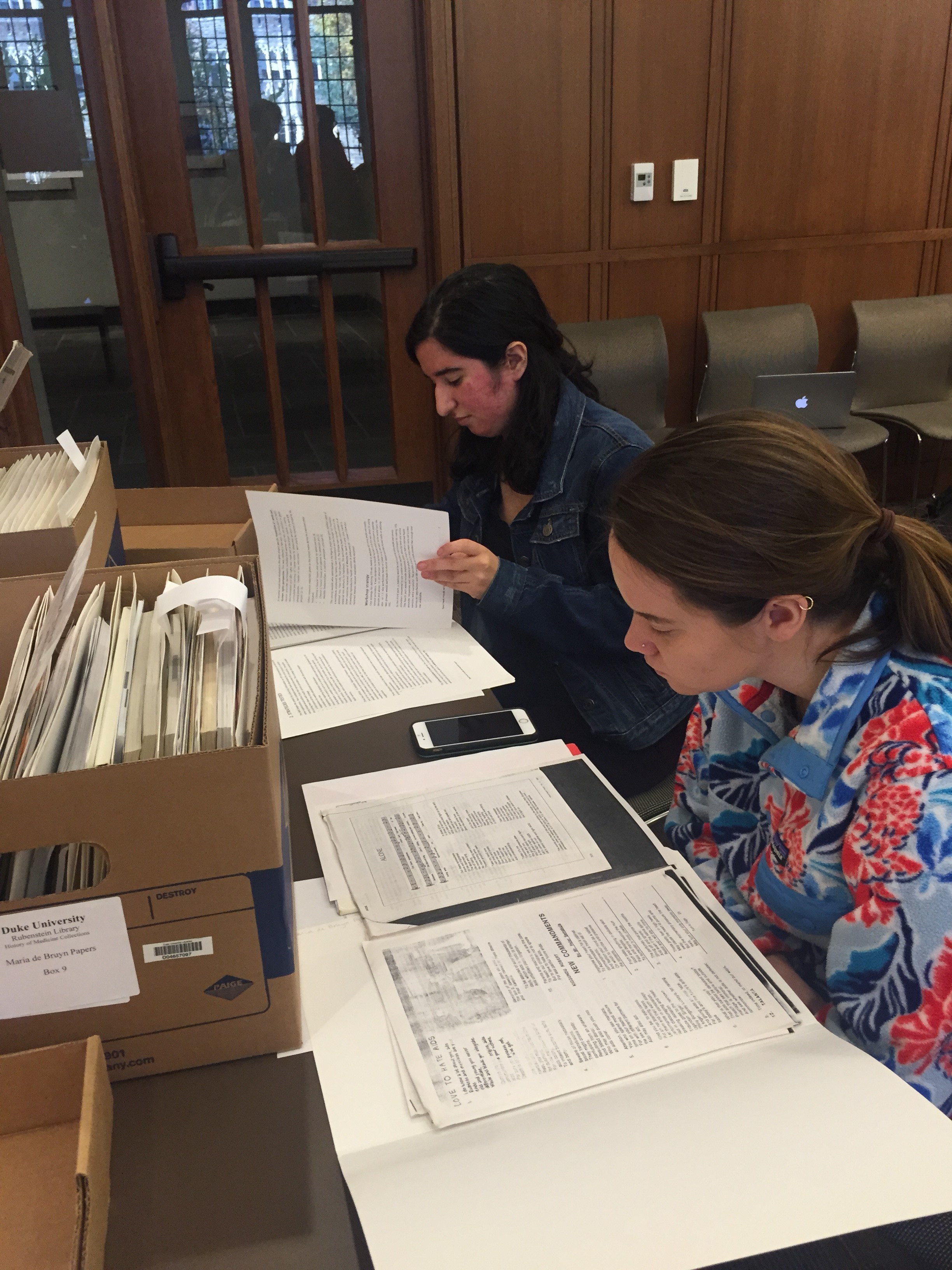 Students in Stewart’s HIV/AIDS Narratives explore the de Bruyn papers. 
