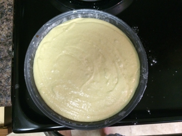 Photograph of raw cake batter in a pan