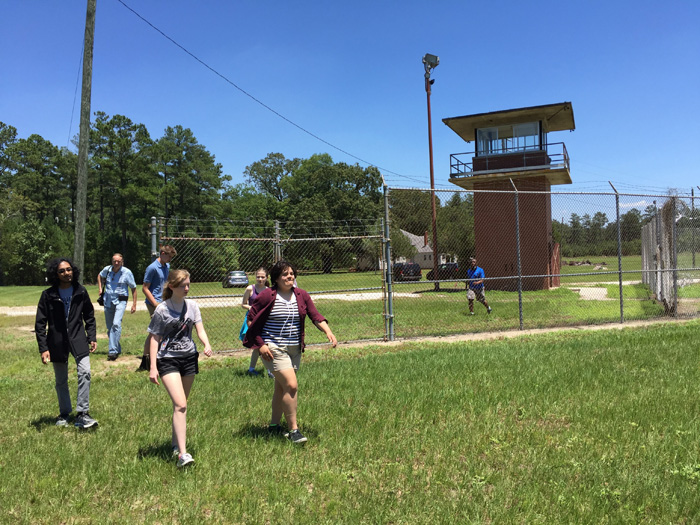 Durham School of the Arts students tour the abandoned prison in Wagram, NC, which the nonprofit organization GrowingChange is hoping to flip into a sustainable farm and education center.