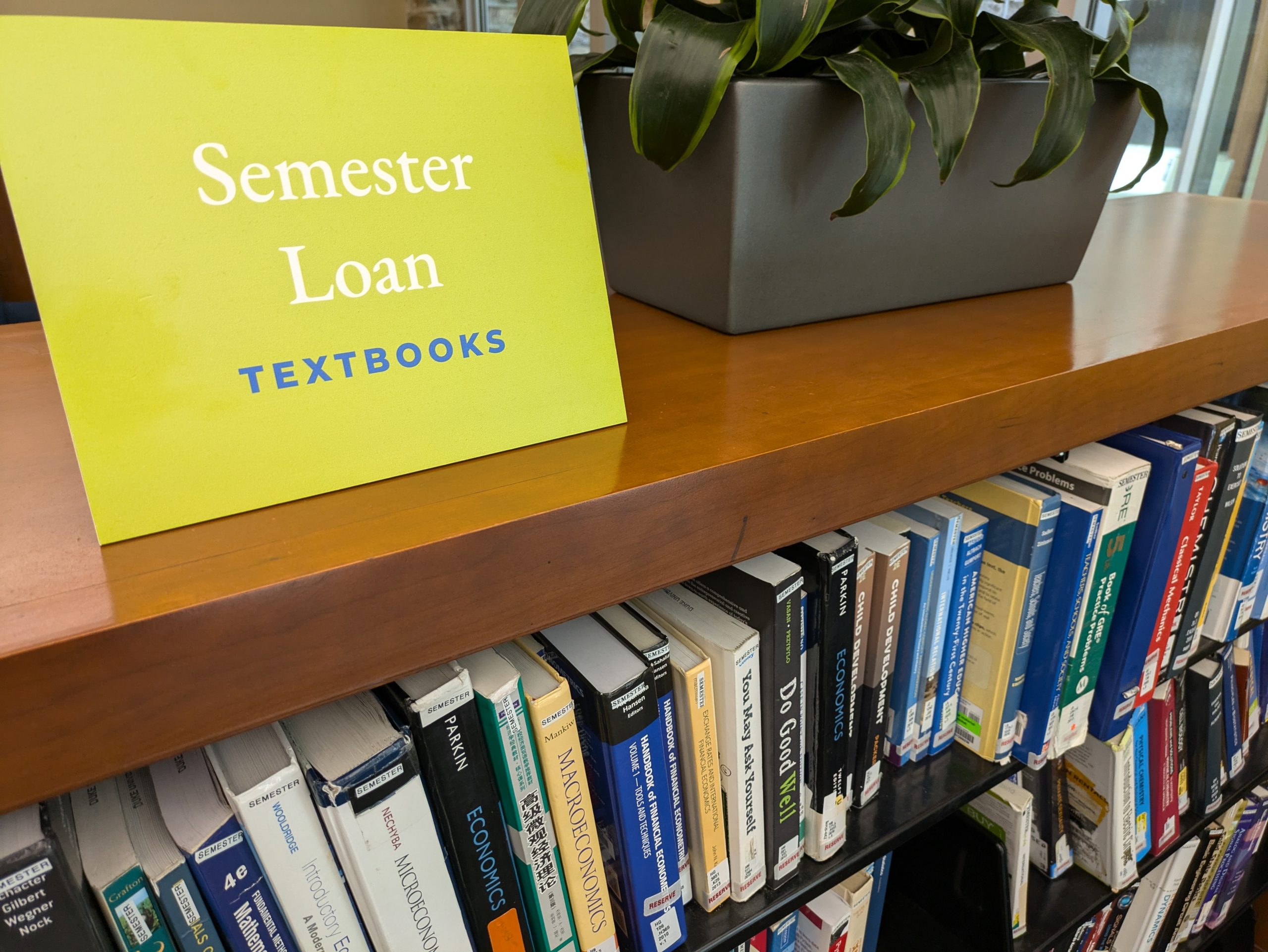 Library bookshelf with textbooks available to check out