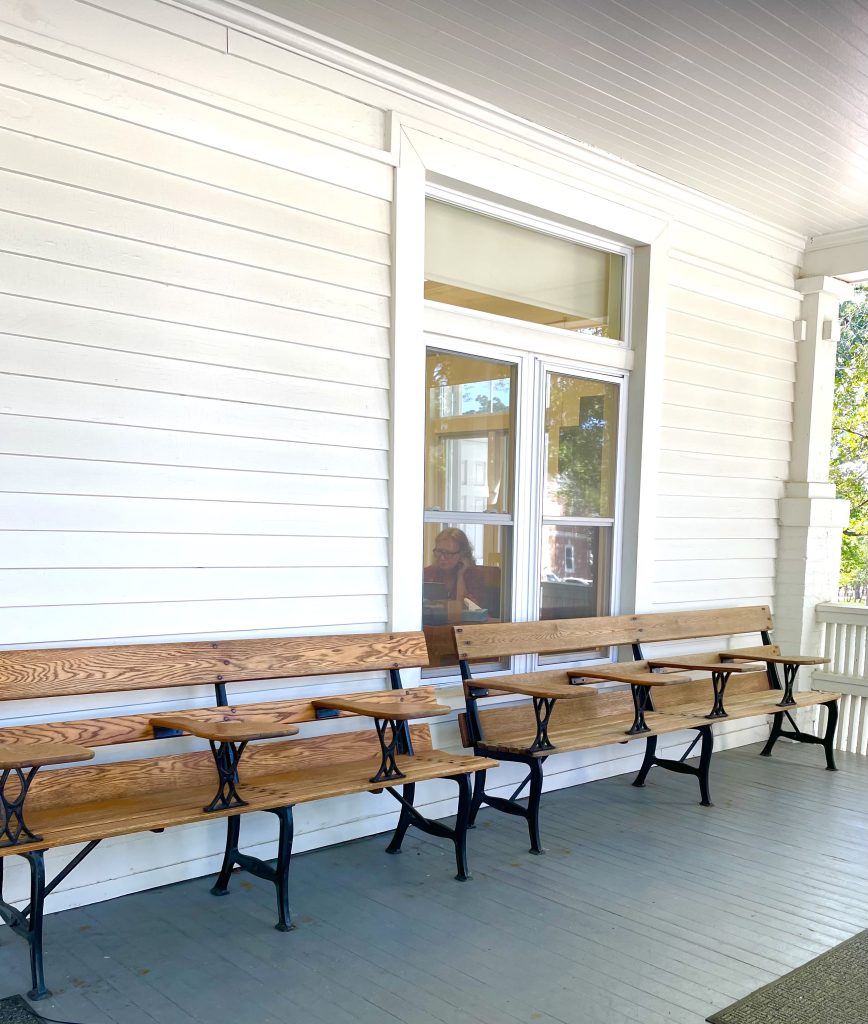 Photograph of outdoor seating on Bishop's House front porch