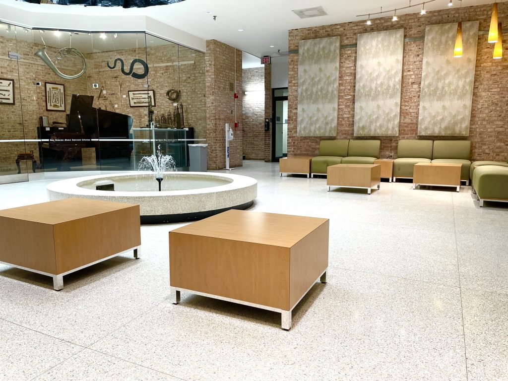 Photograph of soft seating around a fountain in the basement of the Biddle Music Building