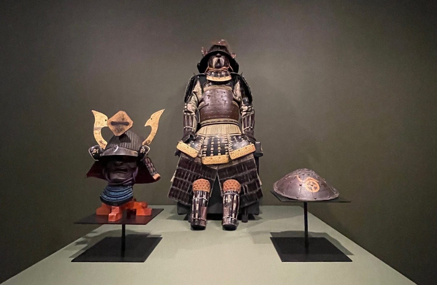 Samurai suit of armor and helmets/masks on display at the North Carolina Museum of Art.