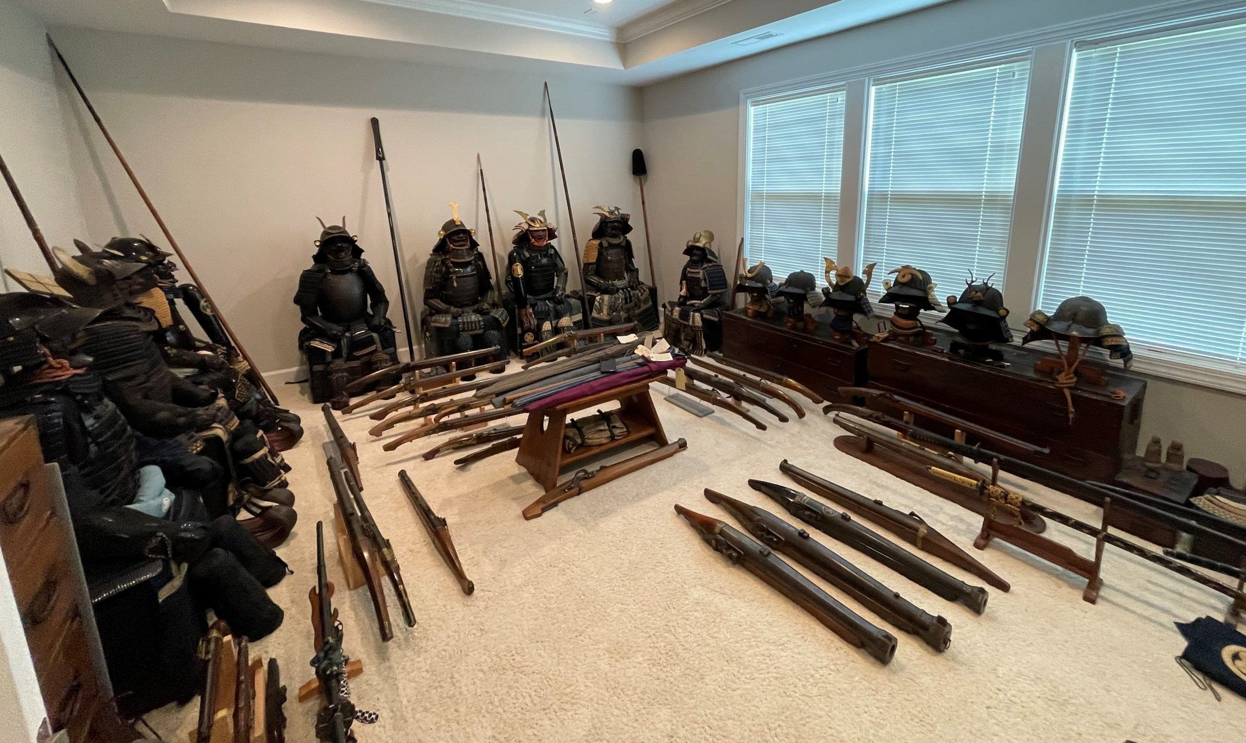 Samurai arms and armor displayed around a room.